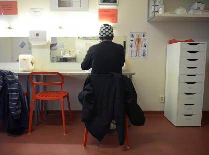 A heroin addict prepares a heroin dose in a room, at the Konsumraume (consumption room) on...